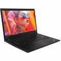 Laptop with a colorful display of a woman wearing sunglasses on the screen.